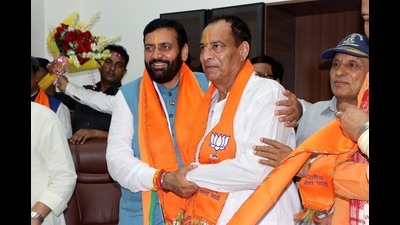 Haryana chief minister Nayab Singh Saini congratulates Bharatiya Janata Party leader Mohan Lal Badoli for taking charge as the state party chief in Rohtak on Sunday. (HT Photo) Haryana chief minister Nayab Singh Saini congratulates Bharatiya Janata Party leader Mohan Lal Badoli for taking charge as the state party chief in Rohtak on Sunday. (HT Photo)