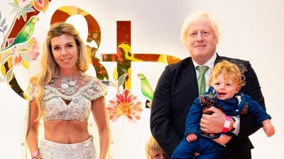 Former UK Prime Minister Boris Johnson attended Anant Ambani's wedding with his wife Carrie Symonds and their kids. Carrie held hands of their four-year-old son Wilfred and their two-year-old daughter Romy, while Boris held their one-year-old son Frank in his arms. Boris wore a black suit with a green tie and Carrie chose to go the Indian way by donning a white crop top and skirt with matching jewellery. Former UK Prime Minister Boris Johnson attended Anant Ambani's wedding with his wife Carrie Symonds and their kids. Carrie held hands of their four-year-old son Wilfred and their two-year-old daughter Romy, while Boris held their one-year-old son Frank in his arms. Boris wore a black suit with a green tie and Carrie chose to go the Indian way by donning a white crop top and skirt with matching jewellery.
