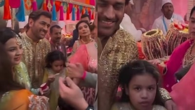 The image shows Ziva Dhoni with MS Dhoni at Ambani wedding. (Screengrab) The image shows Ziva Dhoni with MS Dhoni at Ambani wedding. (Screengrab)