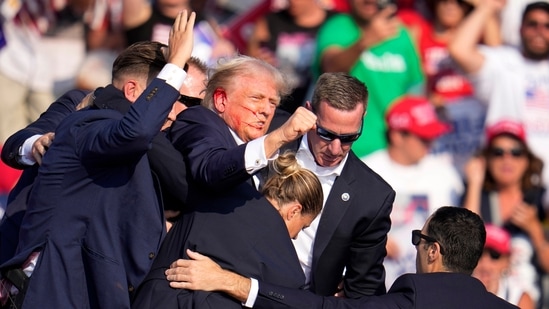 Republican presidential candidate former President Donald Trump is helped off the stage at a campaign event in Butler.(AP)