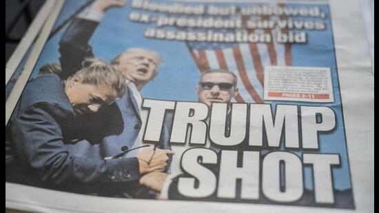 Copies of daily newspapers featuring front page articles about the shooting at former US President Donald Trump's campaign event, in the Brooklyn borough of New York, US, on Sunday, July 14, 2024. Trump confirmed that he will be attending the Republican National Convention next week, hours after he was shot at a campaign rally in Pennsylvania. Photographer: Stephanie Keith/Bloomberg (Bloomberg)