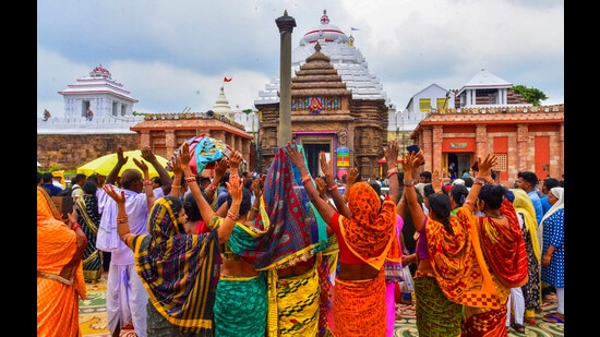 Devotees during the reopening of Ratna Bhandar’ at the Jagannath Temple in Puri on Sunday. (PTI)