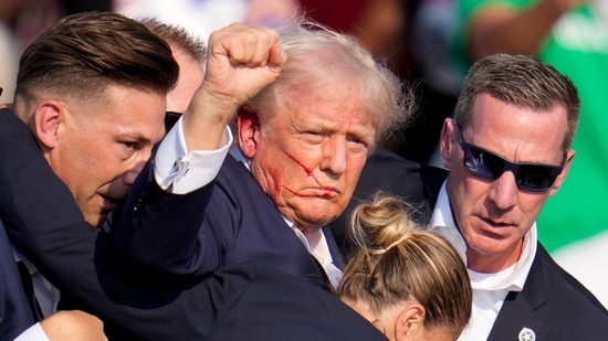 Republican presidential candidate former President Donald Trump is helped off the stage by U.S. Secret Service agents at a campaign event in Butler, Pa., on Saturday(AP)