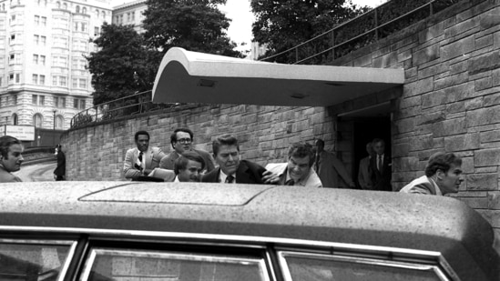 President Ronald Reagan being shoved into the President's limousine by secret service agents after being shot outside a Washington hotel, March 30, 1981. (AP Photo/Ron Edmonds)(AP)