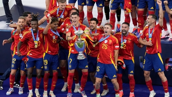 Spain's Alvaro Morata lifts the trophy after winning the final match against England at the Euro 2024 soccer tournament in Berlin, Germany(AP)