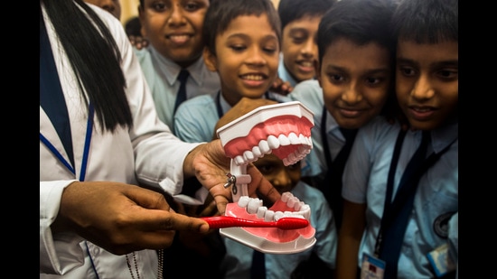 Funded by the Indian Council of Medical Research, the initiative aims to introduce school-based tooth brushing and oral health education to primary school-going children across eight districts of India. (HT File Photo)