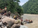Nepal army personnel cary out a search operation looking for the survivors after two buses were swept by a landslide (AP/PTI) Nepal army personnel cary out a search operation looking for the survivors after two buses were swept by a landslide (AP/PTI)