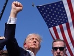 Republican presidential candidate former President Donald Trump reacts as he is surrounded by US Secret Service agents at a campaign rally, on Saturday, in Butler, Pennsylvania. (AP)