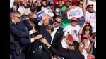 FILE PHOTO: Republican presidential candidate and former U.S. President Donald Trump gestures with a bloodied face while he is assisted by U.S. Secret Service personnel after he was shot in the right ear during a campaign rally at the Butler Farm Show in Butler, Pennsylvania, U.S., July 13, 2024. REUTERS/Brendan McDermid/File Photo (REUTERS) FILE PHOTO: Republican presidential candidate and former U.S. President Donald Trump gestures with a bloodied face while he is assisted by U.S. Secret Service personnel after he was shot in the right ear during a campaign rally at the Butler Farm Show in Butler, Pennsylvania, U.S., July 13, 2024. REUTERS/Brendan McDermid/File Photo (REUTERS)