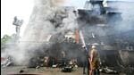 Firefighters douse the blaze on Monday. (Ajay Aggarwal/HT) Firefighters douse the blaze on Monday. (Ajay Aggarwal/HT)