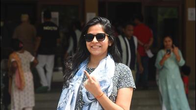 A woman shows her ink-stained finger after casting her vote in the Lok Sabha elections in a polling booth inside a condominium in Gurugram Sector 49 on May 25. (Parveen Kumar/HT Photo) A woman shows her ink-stained finger after casting her vote in the Lok Sabha elections in a polling booth inside a condominium in Gurugram Sector 49 on May 25. (Parveen Kumar/HT Photo)