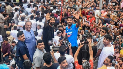 Hardik Pandya and his brother and fellow cricketer Krunal Pandya wave during a roadshow to celebrate India's victory in the T20 World Cup. (PTI) Hardik Pandya and his brother and fellow cricketer Krunal Pandya wave during a roadshow to celebrate India's victory in the T20 World Cup. (PTI)