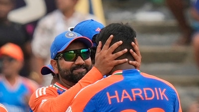 India's captain Rohit Sharma, facing the camera, hugs teammate Hardik Pandya as they celebrate their win against South Africa (PTI) India's captain Rohit Sharma, facing the camera, hugs teammate Hardik Pandya as they celebrate their win against South Africa (PTI)