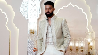 Canadian singer and rapper AP Dhillon poses for paparazzi as he attends Anant Ambani and Radhika Merchant's wedding, at Jio World Convention Centre, in Mumbai, Friday, July 12, 2024. (PTI) Canadian singer and rapper AP Dhillon poses for paparazzi as he attends Anant Ambani and Radhika Merchant's wedding, at Jio World Convention Centre, in Mumbai, Friday, July 12, 2024. (PTI)