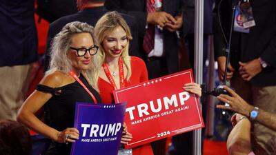 People holding signs in support of Republican presidential candidate and former U.S. President Donald Trump pose on Day 1 of the Republican National Convention (RNC) at the Fiserv Forum in Milwaukee, Wisconsin, U.S., July 15, 2024. (REUTERS) People holding signs in support of Republican presidential candidate and former U.S. President Donald Trump pose on Day 1 of the Republican National Convention (RNC) at the Fiserv Forum in Milwaukee, Wisconsin, U.S., July 15, 2024. (REUTERS)