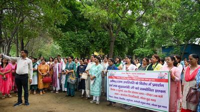 Representatives of Uttar Pradesh Prathamik Shikshak Sangh, who submitted a memorandum to basic education officer, Gautam Budh Nagar on Monday, argued that rules like this should apply to all government departments in the state and not teachers alone. (HT Photo)