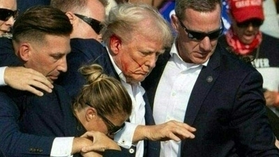 Former President and Republican candidate Donald Trump was injured in the ear during an assassination attempt by a gunman at a campaign rally in Butler, Pennsylvania, on Saturday, July 13. (AFP) Former President and Republican candidate Donald Trump was injured in the ear during an assassination attempt by a gunman at a campaign rally in Butler, Pennsylvania, on Saturday, July 13. (AFP)
