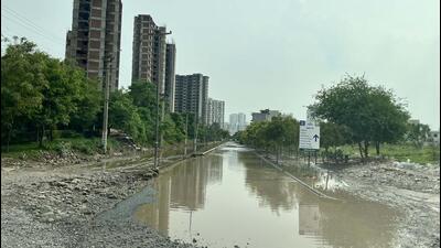 The waterlogged road stretch in Gurugram Sector 82 connected to Blocks E, F, G, and H in Vatika Next on Thursday. (Parveen Kumar/HT Photo) The waterlogged road stretch in Gurugram Sector 82 connected to Blocks E, F, G, and H in Vatika Next on Thursday. (Parveen Kumar/HT Photo)