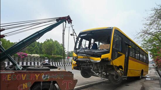 Before the driver could apply the brakes, the bus crashed into the railing. The front part of the bus got stuck on the railing, and the driver alighted safely. (Suni Ghosh/HT Photo)