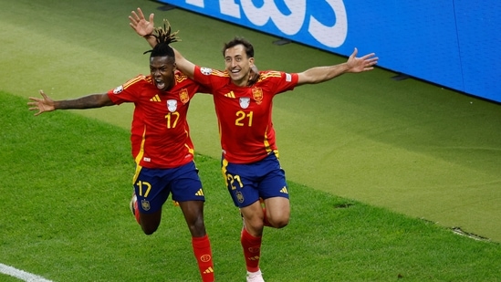 Spain's midfielder Mikel Oyarzabal celebrates with midfielder (17) Nico Williams after scoring his team's second goal during the UEFA Euro 2024 final football match between Spain and England at the Olympiastadion in Berlin on July 14, 2024. (AFP)