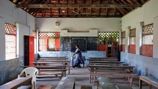 A staff member walks inside an empty classroom of a school in Kerala (Reuters/ File photo)