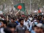 Anti-quota protesters march with Bangladeshi flags and sticks as they engage in a clash with Bangladesh Chhatra League, the student wing of the ruling party Bangladesh Awami League, at the University of Dhaka, in Dhaka, Bangladesh, July 16, 2024. REUTERS/Mohammad Ponir Hossain