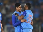 India's Shubman Gill (C) and teammate Hardik Pandya (R)(AFP) India's Shubman Gill (C) and teammate Hardik Pandya (R)(AFP)
