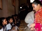 Kim Kardashian and Khloe Kardashian serve food to children at ISKCON temple in Juhu, Mumbai Kim Kardashian and Khloe Kardashian serve food to children at ISKCON temple in Juhu, Mumbai