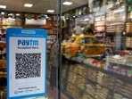 A QR code sticker of the digital payment app Paytm is seen outside a grocery store in Kolkata, India.