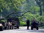 Chicago and surrounding areas devastated by Derecho storm with power outages, uprooted trees, and dangerous wind gusts Chicago and surrounding areas devastated by Derecho storm with power outages, uprooted trees, and dangerous wind gusts