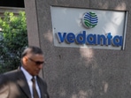 Vedanta QIP: A man walks past the logo of Vedanta outside its headquarters in Mumbai.