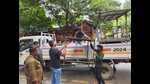 During the action, staffers removed illegal flex, banners, and structures encroaching footpaths and roadsides, clearing almost 15,000 sq feet of encroachments. (HT PHOTO) During the action, staffers removed illegal flex, banners, and structures encroaching footpaths and roadsides, clearing almost 15,000 sq feet of encroachments. (HT PHOTO)
