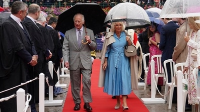 Britain King Charles III and Queen Camilla arrive at the Royal Square in St Helier, Jersey, for special sittings of the States Assembly and of the Royal Court, during their two day visit to the Channel Islands, Monday July 15, 2024. AP/PTI(AP07_15_2024_000254A) (AP) Britain King Charles III and Queen Camilla arrive at the Royal Square in St Helier, Jersey, for special sittings of the States Assembly and of the Royal Court, during their two day visit to the Channel Islands, Monday July 15, 2024. AP/PTI(AP07_15_2024_000254A) (AP)