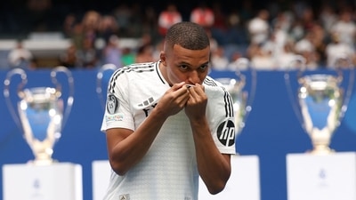 Kylian Mbappe kisses his jersey during his first appearance as a Real Madrid player at the Santiago Bernabeu Stadium in Madrid (AFP) Kylian Mbappe kisses his jersey during his first appearance as a Real Madrid player at the Santiago Bernabeu Stadium in Madrid (AFP)