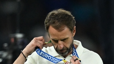England's head coach Gareth Southgate reacts with his silver medal after the UEFA Euro 2024 final football match between Spain and England (AFP) England's head coach Gareth Southgate reacts with his silver medal after the UEFA Euro 2024 final football match between Spain and England (AFP)