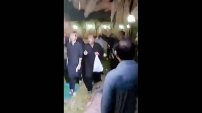 This image grab from a UGC video taken on July 16, 2024 shows shows people fleeing the scene of a shooting at the Imam Ali Mosque in the Al-Wadi Al-Kabir area in the east of Oman's capital Muscat. (Photo by UGC / AFP) / RESTRICTED TO EDITORIAL USE � MANDATORY CREDIT �  AFP PHOTO / [SOURCE]  � - NO MARKETING NO ADVERTISING CAMPAIGNS � DISTRIBUTED AS A SERVICE TO CLIENTS [- NO ARCHIVE ]