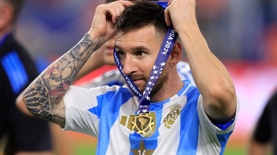 Lionel Messi of Argentina puts on his medal after a victory in the CONMEBOL Copa America 2024 Final against Colombia (Getty Images via AFP) Lionel Messi of Argentina puts on his medal after a victory in the CONMEBOL Copa America 2024 Final against Colombia (Getty Images via AFP)