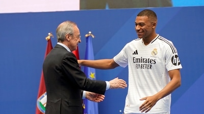 Real Madrid president Florentino Perez embraces Kylian Mbappe, of France, during his presentation to fans as a new Real Madrid player at the Santiago Bernabeu (AP) Real Madrid president Florentino Perez embraces Kylian Mbappe, of France, during his presentation to fans as a new Real Madrid player at the Santiago Bernabeu (AP)