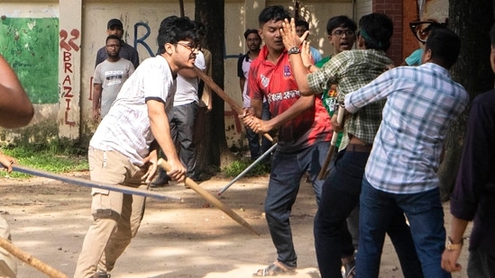 Students clash over quota system at Jahangir Nagar University at Savar outside Dhaka. Police have fired tear gas and charged with batons overnight during violent clashes between a pro-government student body and student protesters, leaving dozens injured at a leading public university outside Bangladesh's capital over quota system in government jobs, police and students said Tuesday. (AP Photo/Abdul Goni)