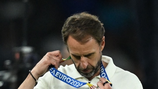 England's head coach Gareth Southgate reacts with his silver medal after the UEFA Euro 2024 final football match between Spain and England(AFP)