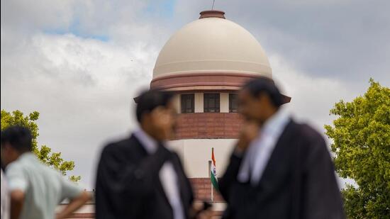 Lawyers at the Supreme Court of India in New Delhi. (PTI Photo)