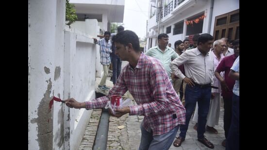 Officials marking a house in Rahim Nagar recently. (File Photo) Officials marking a house in Rahim Nagar recently. (File Photo)