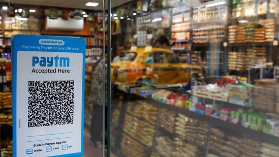 A QR code sticker of the digital payment app Paytm is seen outside a grocery store in Kolkata, India.(Reuters)
