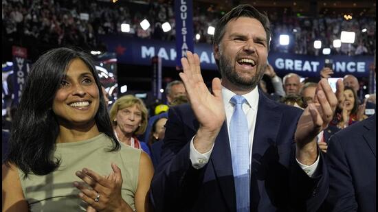 Republican vice-presidential candidate Senator JD Vance, R-Ohio, and his wife Usha Chilukuri Vance arrive on the floor during the first day of the 2024 Republican National Convention at the Fiserv Forum, on Monday. (AP)