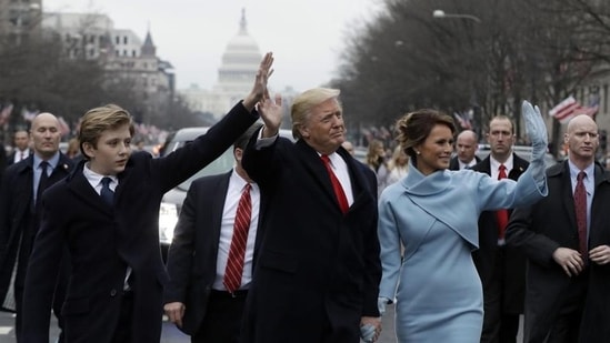 President Donald Trump waves as he walks with first lady Melania Trump and their son Barron during the inauguration parade on January 20. Ten-year-old Barron has recently become the target of mean comments and tweets.(AP)