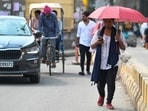 Noida, India- July 11, 2024: Due to the increase in temperature and humidity after the rain in Delhi-NCR, passengers are walking under umbrella to avoid the heat, in Noida, India, on Thursday, July 11, 2024. (Photo by Sunil Ghosh / Hindustan Times) Noida, India- July 11, 2024: Due to the increase in temperature and humidity after the rain in Delhi-NCR, passengers are walking under umbrella to avoid the heat, in Noida, India, on Thursday, July 11, 2024. (Photo by Sunil Ghosh / Hindustan Times)