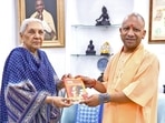 Uttar Pradesh Chief Minister Yogi Adityanath presents the 'Six Golden Pages' book written by Vinayak Damodar Savarkar to State Governor Anandiben Patel during a courtesy call, at Raj Bhavan in Lucknow on Wednesday. (ANI Photo)
(Governor of UP-X) Uttar Pradesh Chief Minister Yogi Adityanath presents the 'Six Golden Pages' book written by Vinayak Damodar Savarkar to State Governor Anandiben Patel during a courtesy call, at Raj Bhavan in Lucknow on Wednesday. (ANI Photo)
(Governor of UP-X)