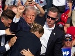 (FILES) Republican candidate Donald Trump is seen with blood on his face surrounded by secret service agents as he is taken off the stage at a campaign event at Butler Farm Show Inc. in Butler, Pennsylvania, July 13, 2024. A Florida judge appointed by Donald Trump has dismissed the criminal case against the former president on charges of mishandling top secret documents, on July 15, 2024 saying the way that Special Counsel Jack Smith was appointed was improper. (Photo by Rebecca DROKE / AFP) (FILES) Republican candidate Donald Trump is seen with blood on his face surrounded by secret service agents as he is taken off the stage at a campaign event at Butler Farm Show Inc. in Butler, Pennsylvania, July 13, 2024. A Florida judge appointed by Donald Trump has dismissed the criminal case against the former president on charges of mishandling top secret documents, on July 15, 2024 saying the way that Special Counsel Jack Smith was appointed was improper. (Photo by Rebecca DROKE / AFP)