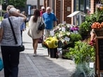 Shoppers pass a flower shop in Strood, UK. Grocery price inflation fell to its lowest level since September 2021 in a further sign of easing cost pressures, ahead of a crucial decision by the Bank of England next month on whether to cut interest rates.