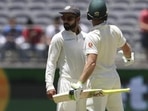 India's Virat Kohli, centre, looks to the umpire after he and opposing captain, Australia's Tim Paine came face to face in Perth. India's Virat Kohli, centre, looks to the umpire after he and opposing captain, Australia's Tim Paine came face to face in Perth.